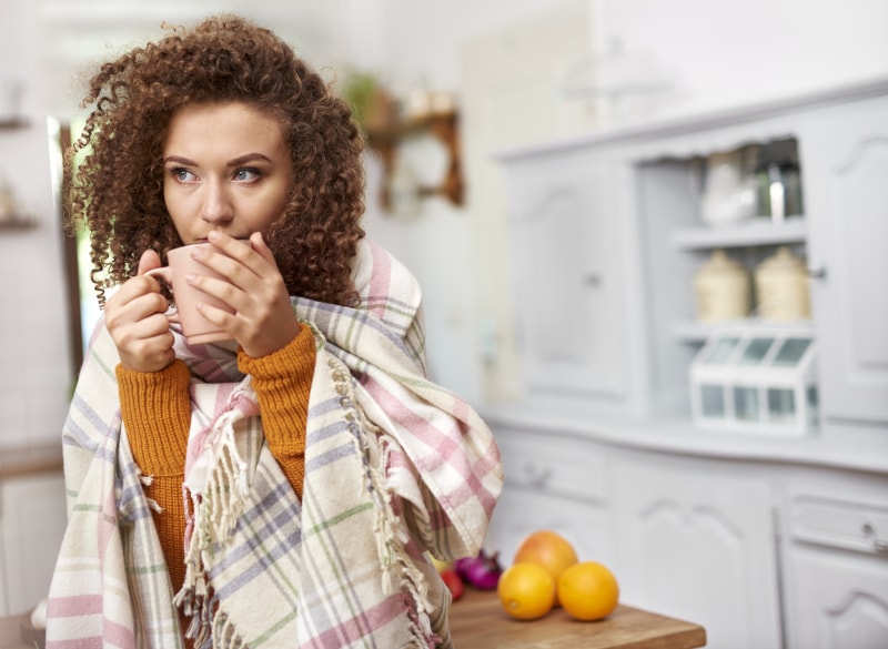 Woman Drinking Tea With Blanket
